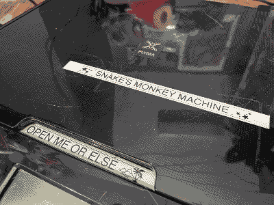 the printer in question. there's a label on its lid that says 'SNAKE'S MONKEY MACHINE'.